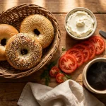 Einstein Bros Bagels calories, bagels with cream cheese and coffee on a breakfast table