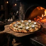 Frank Pepe secret menu white clam pizza coming out of coal-fired oven