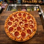 Hunt Brothers Pizza menu prices 2026 pepperoni pizza at a convenience store counter