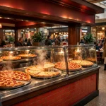 A Sbarro-style pizza storefront inside a shopping mall food court