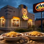 Skyline Chili deals: cozy restaurant storefront at dusk with steaming bowls of Cincinnati-style chili