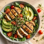 Sweetgreen menu calories: fresh salad bowl with greens, avocado and roasted chicken