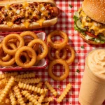 The Varsity menu prices 2026 - chili dog, burger, onion rings and Frosted Orange